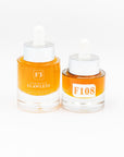Two bottles of Formula Flawless skincare product on a white background