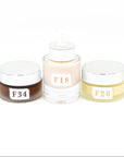 Three cosmetic jars with labels F34, F18, and F20 on a white background