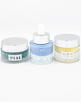 Three cosmetic jars with labels on a white background