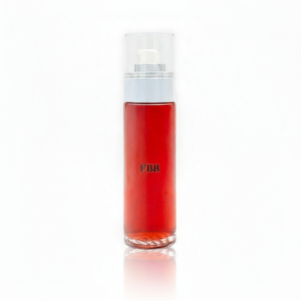 Red bottle with a white cap on a white background