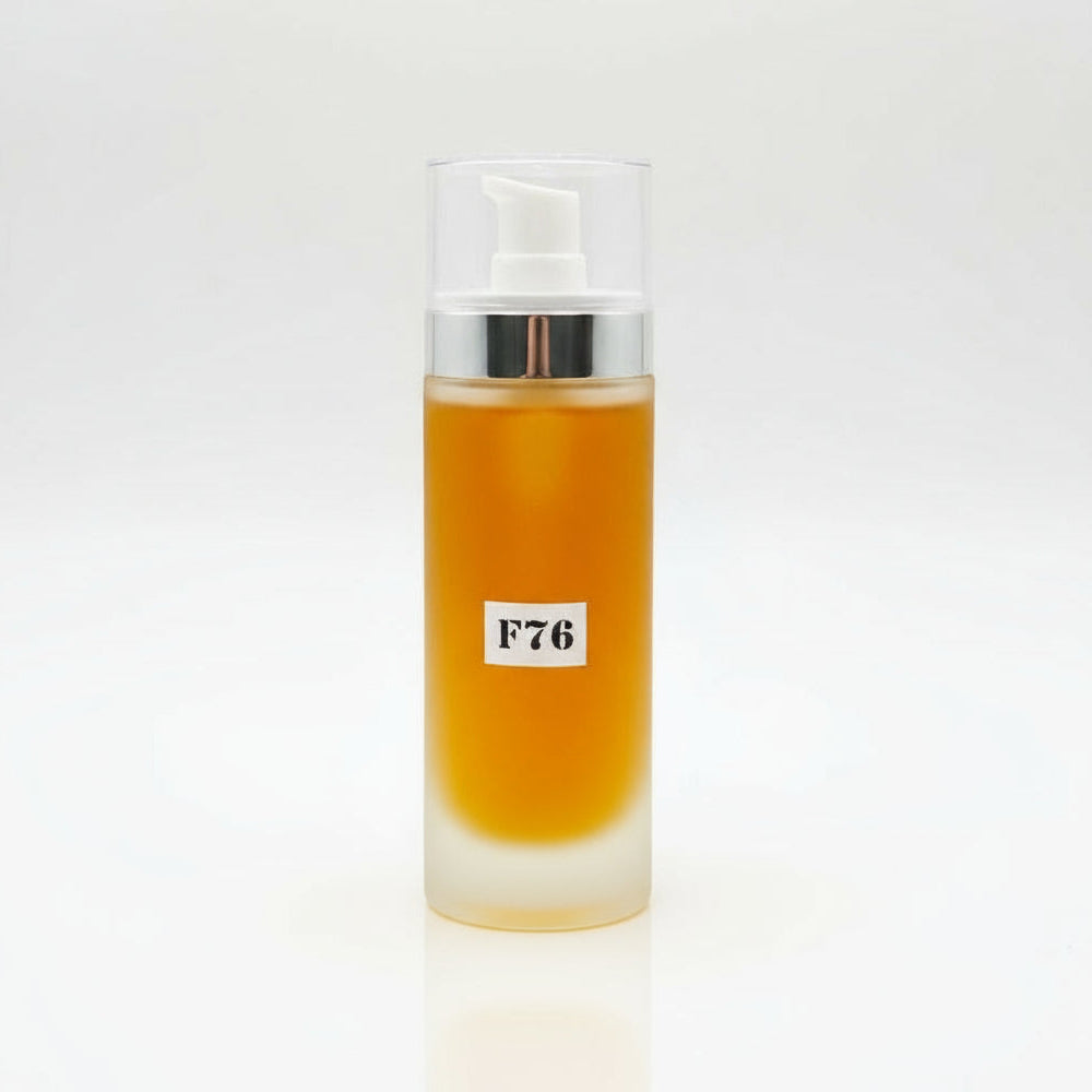 Bottle with a yellow liquid and 'F76' label on a white background