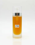 Bottle with a yellow liquid and 'F76' label on a white background