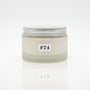 A jar of body cream labeled F74 SUMMER BREEZE BODY CREAM, placed on a wooden surface with floral background.