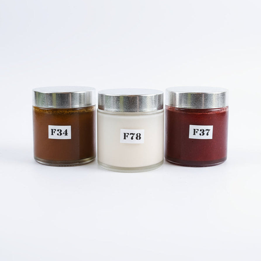 Three jars with silver lids and labeled numbers on a white background