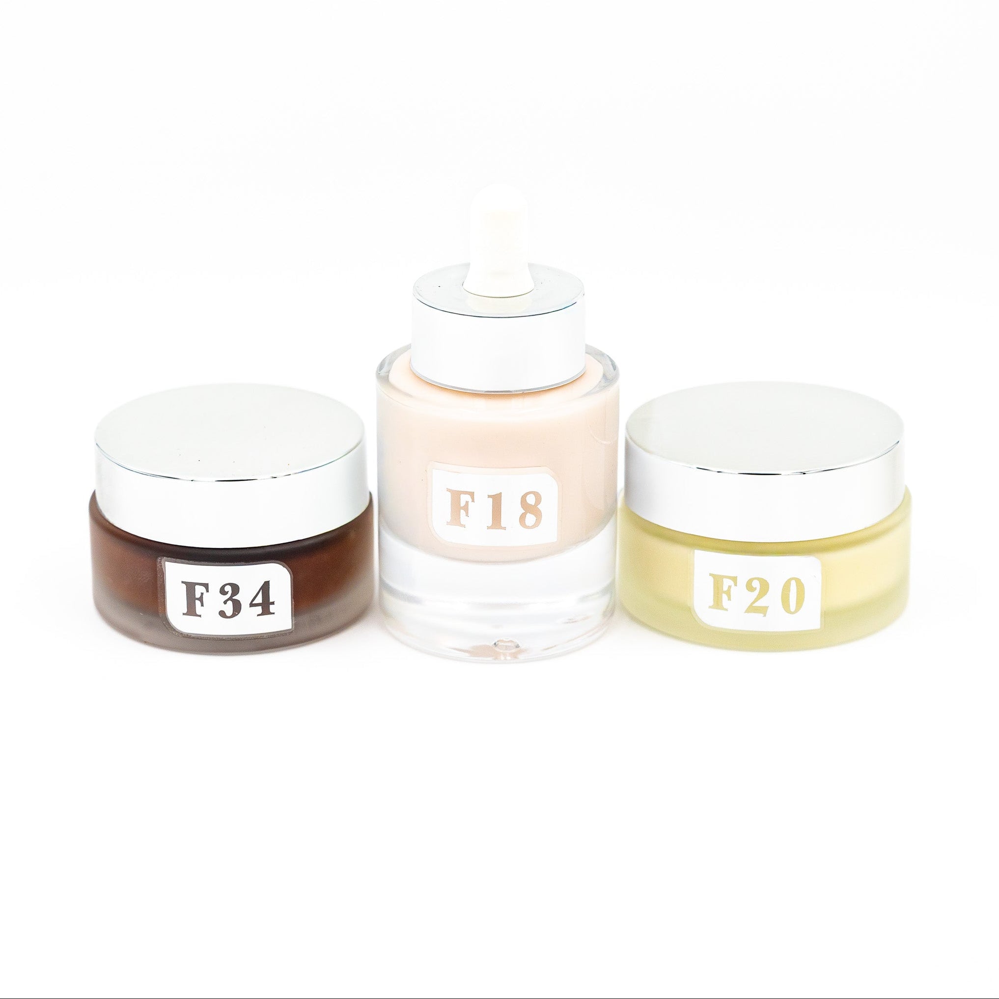 Three cosmetic jars with labels F34, F18, and F20 on a white background