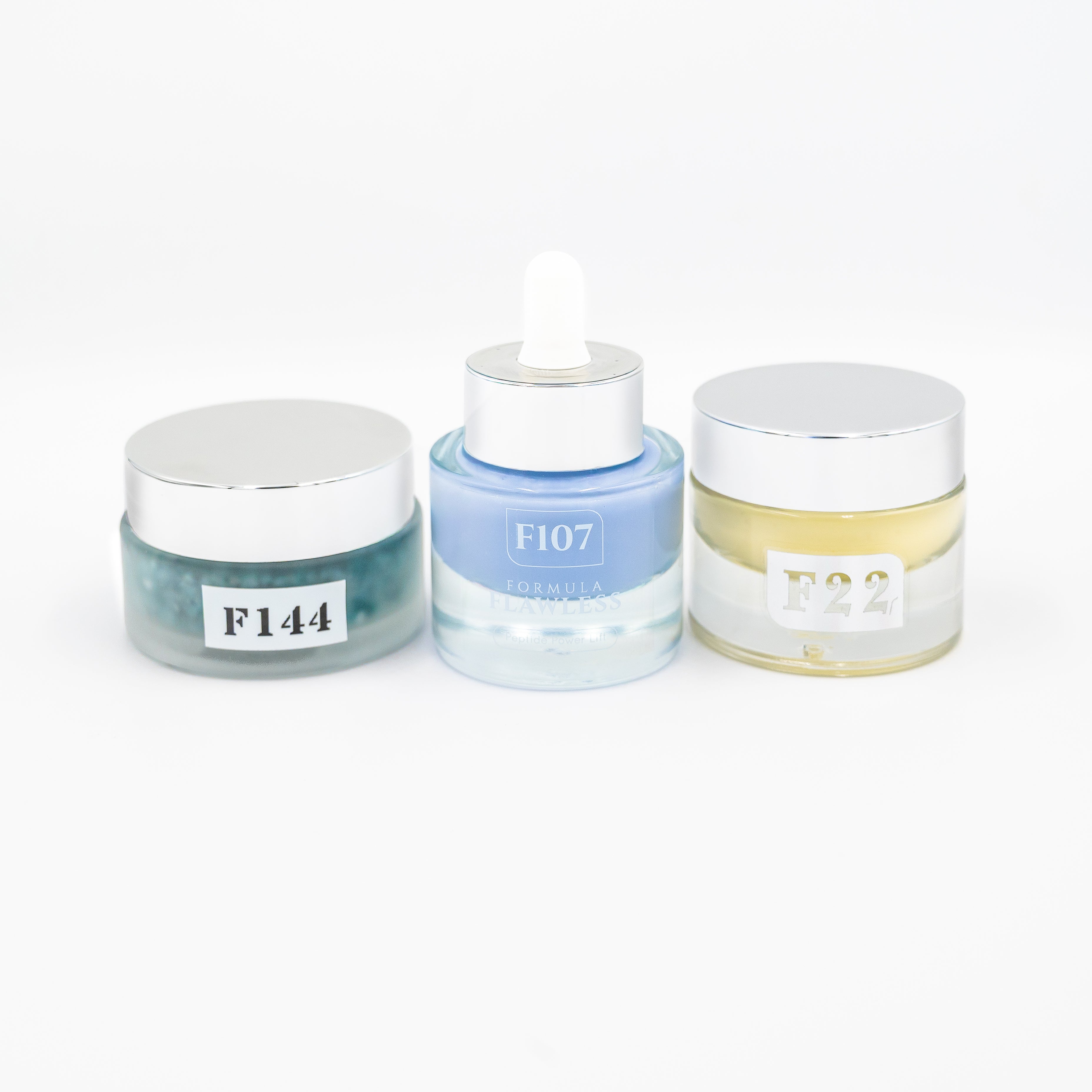 Three cosmetic jars with labels on a white background