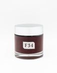 Jar with a white lid and label displaying 'F34' on a white background