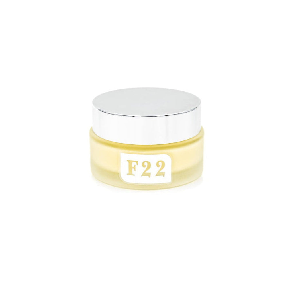 Jar of cream with 'F22' label on a white background