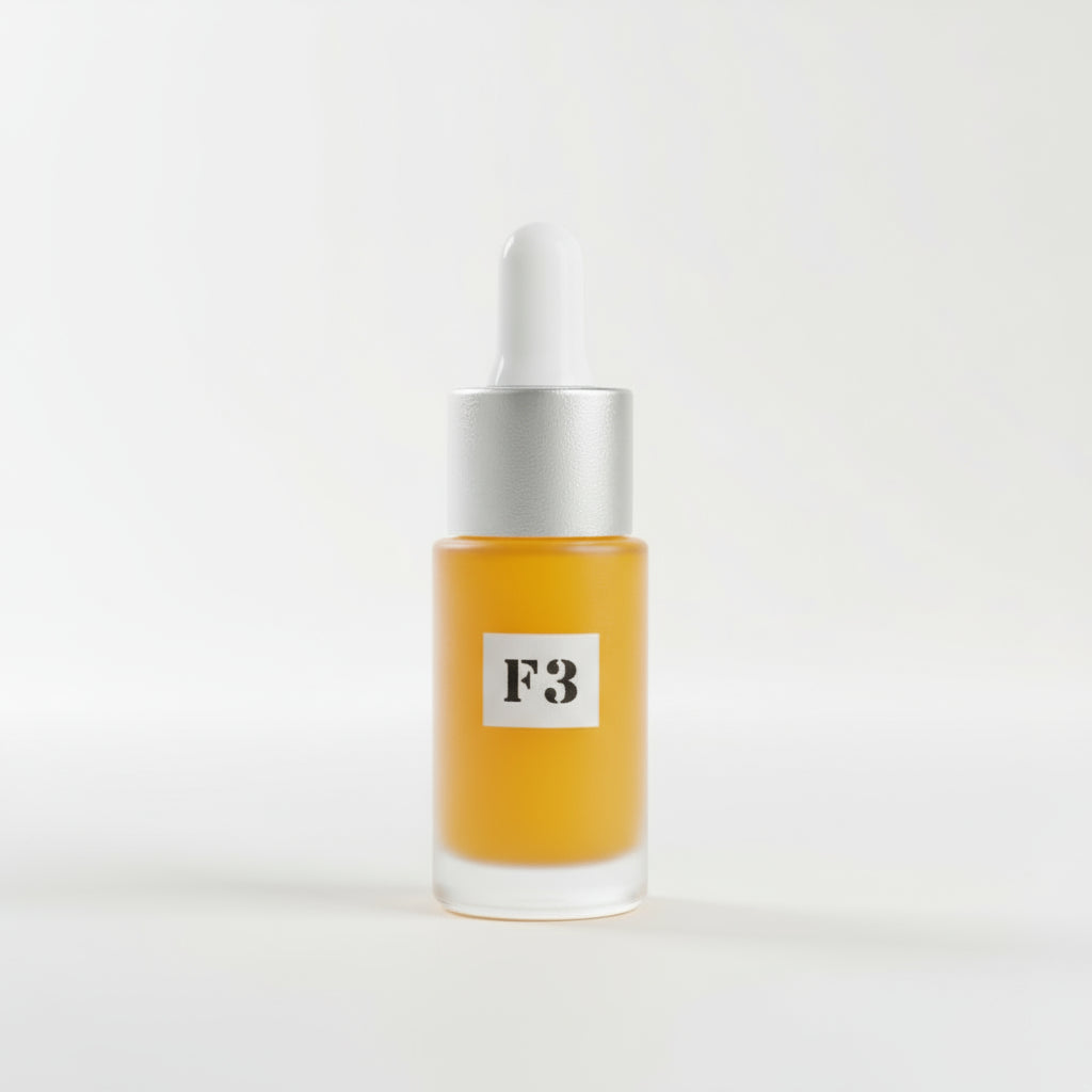 A 3ml dropper bottle of an orange-colored serum, labeled 'F3', placed on a surface with a green and pink flower background.